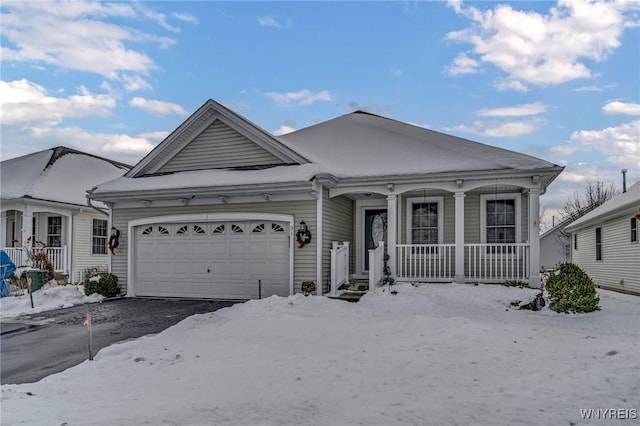 view of front of property featuring covered porch and a garage