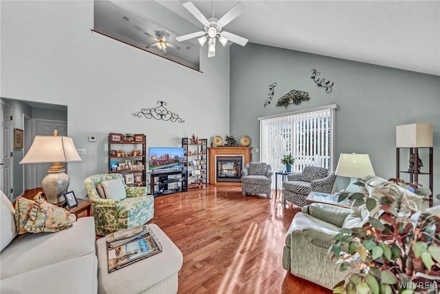 living room with hardwood / wood-style flooring and ceiling fan