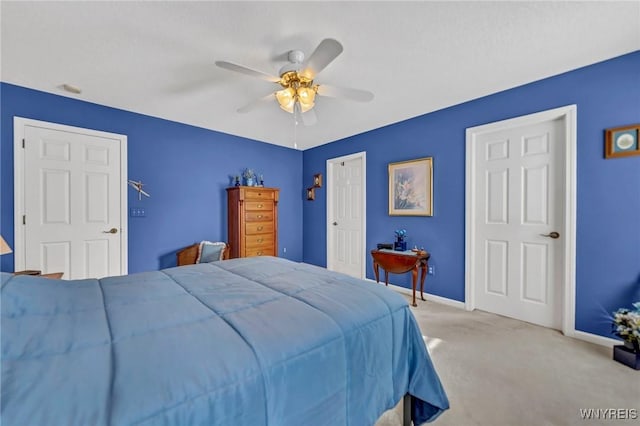 carpeted bedroom with ceiling fan