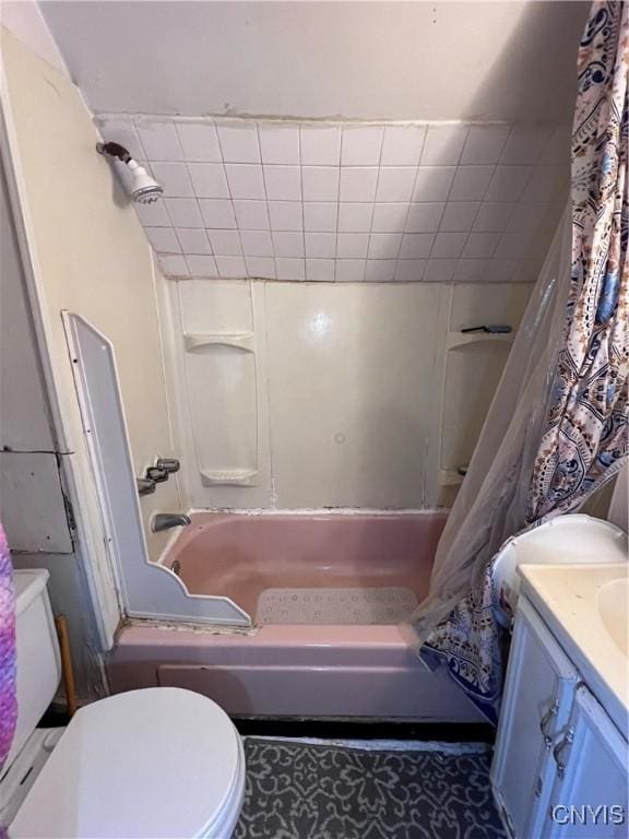 full bathroom with vanity, toilet, and shower / bath combo with shower curtain