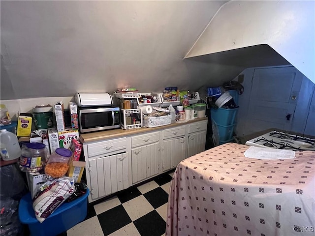 kitchen featuring white cabinets