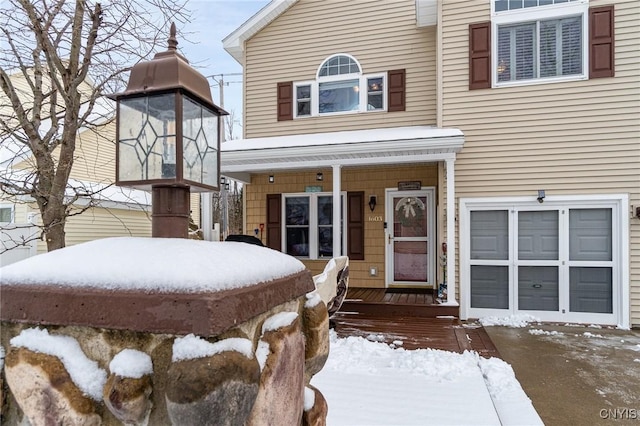 view of snow covered property entrance