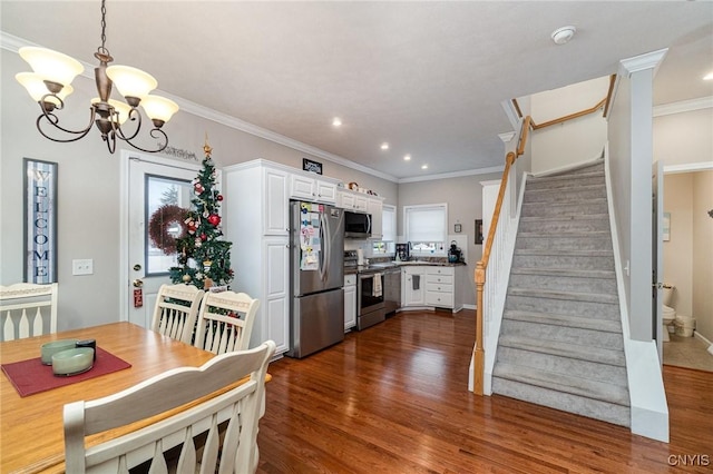 dining room featuring an inviting chandelier, dark hardwood / wood-style floors, and ornamental molding