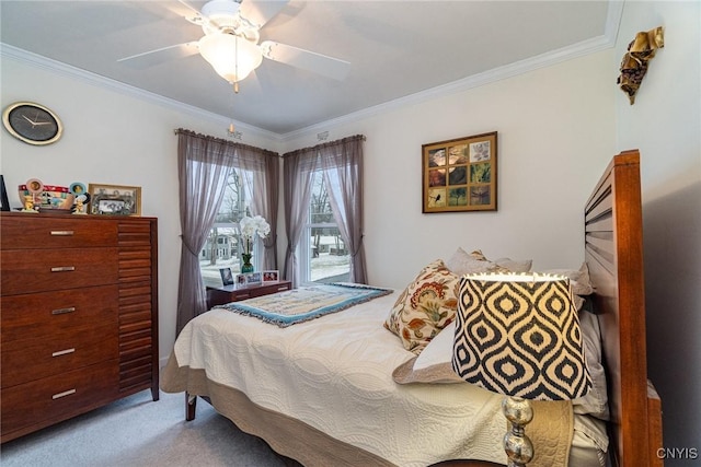 bedroom with ceiling fan, crown molding, and light colored carpet