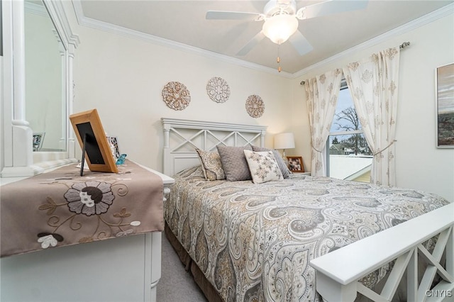 carpeted bedroom featuring ceiling fan and ornamental molding