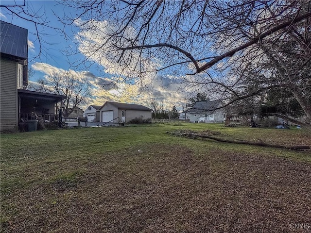 view of yard at dusk