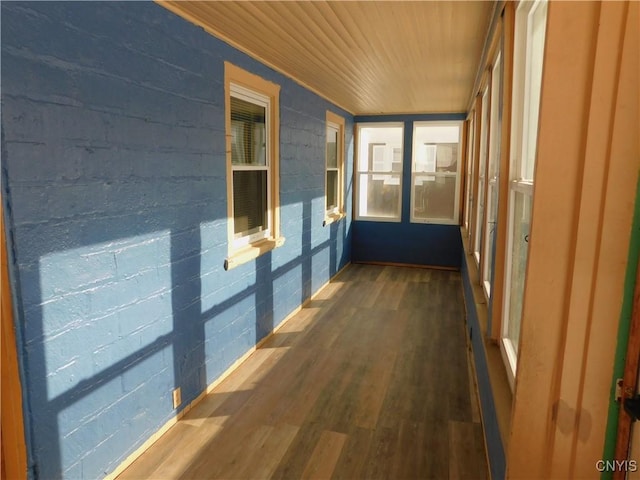 unfurnished sunroom with wooden ceiling