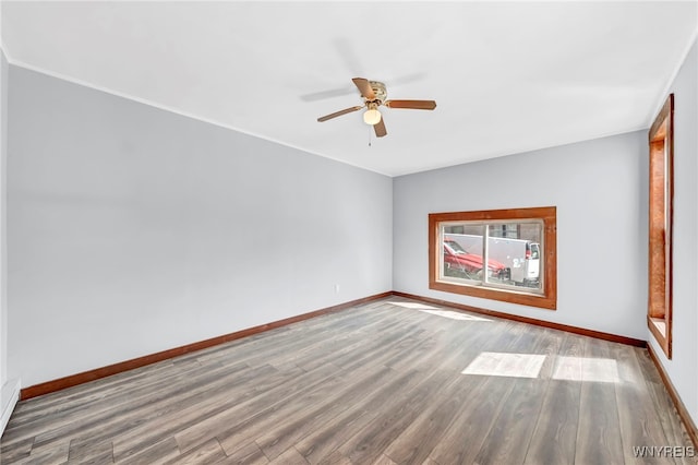 spare room featuring ceiling fan and wood-type flooring