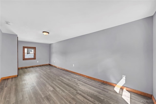 spare room featuring light wood-type flooring