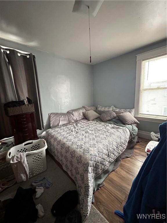 bedroom featuring wood-type flooring