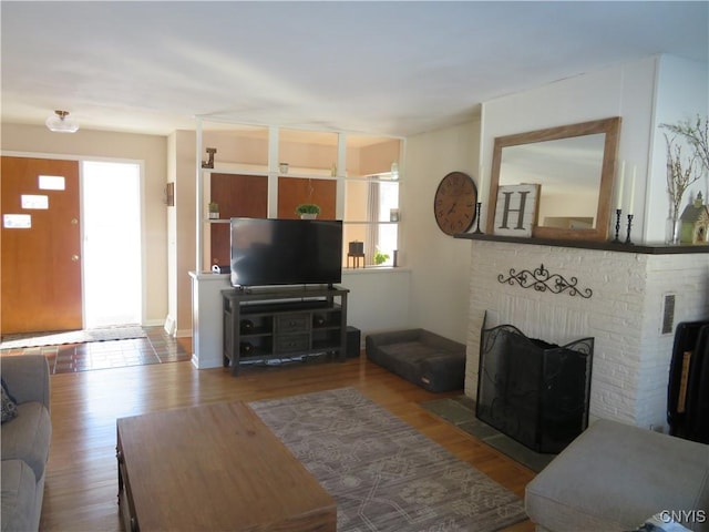 living room featuring a fireplace and hardwood / wood-style floors