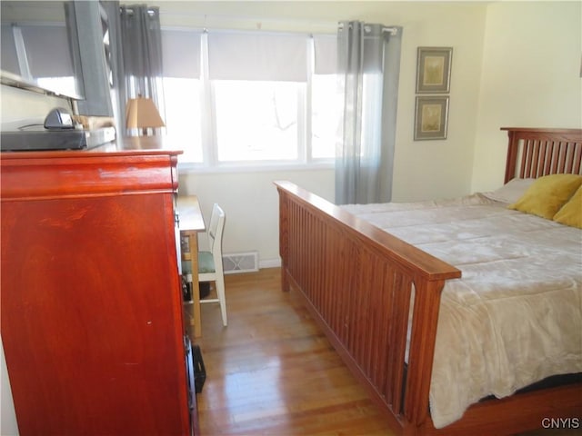 bedroom with light hardwood / wood-style flooring