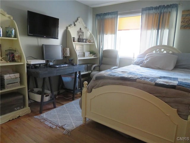 bedroom with dark wood-type flooring