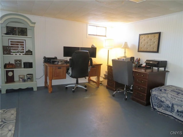 home office featuring concrete flooring