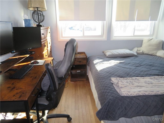 bedroom with light hardwood / wood-style flooring