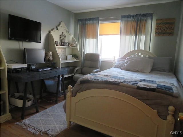 bedroom featuring dark hardwood / wood-style floors