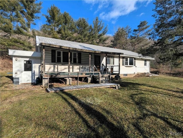 7909 County Route 333, Thurston, NY 14821 - back of property featuring a porch, metal roof, and a lawn
