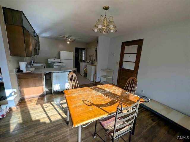 7909 County Route 333, Thurston, NY 14821 - dining area with separate washer and dryer, ceiling fan with notable chandelier, baseboards, and wood finished floors