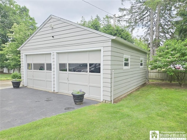 garage featuring a yard