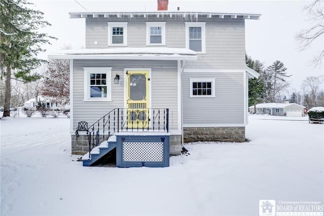 view of snow covered house