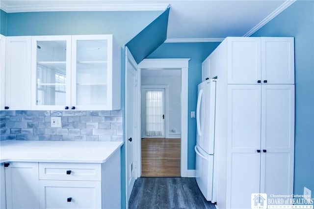 laundry room with dark hardwood / wood-style floors and crown molding