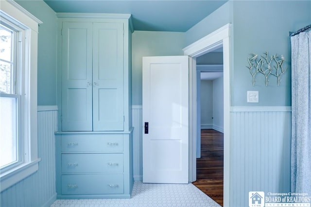 interior space featuring multiple windows and a closet