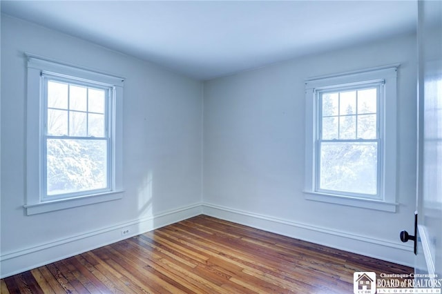 empty room featuring wood-type flooring