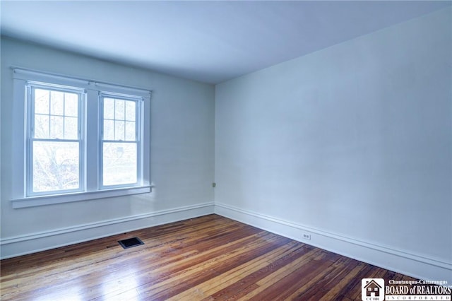 empty room featuring wood-type flooring