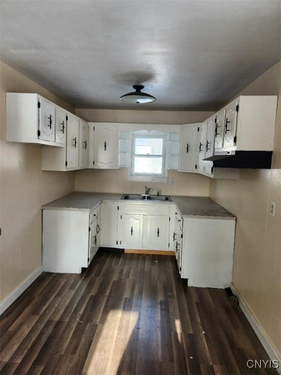 kitchen with dark hardwood / wood-style flooring, white cabinetry, sink, and ceiling fan