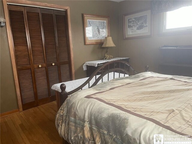 355 New Buffalo Rd, French Creek, NY 14724 - bedroom featuring hardwood / wood-style flooring, a closet, and baseboards