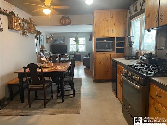 kitchen featuring range with gas cooktop, ceiling fan, stainless steel microwave, and black dishwasher