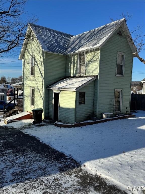 view of snow covered house