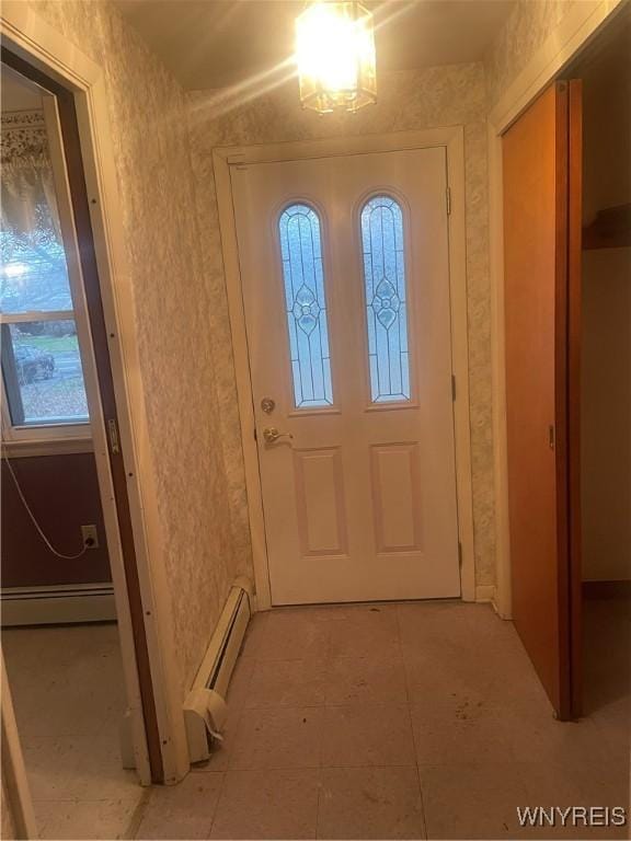 entryway featuring a baseboard heating unit