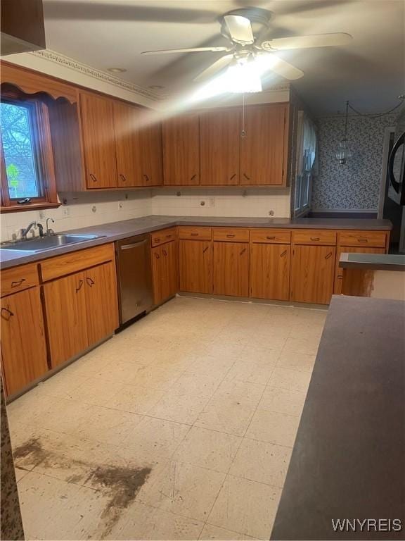 kitchen with tasteful backsplash, ceiling fan, sink, and stainless steel dishwasher