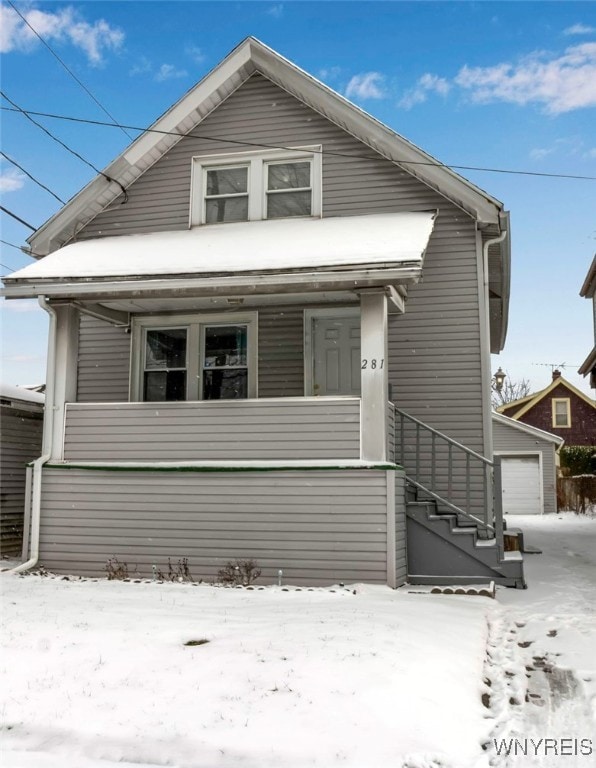 bungalow-style home with an outbuilding and a garage