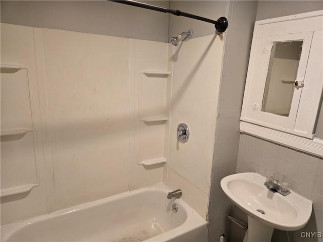 bathroom featuring shower / bathing tub combination and sink