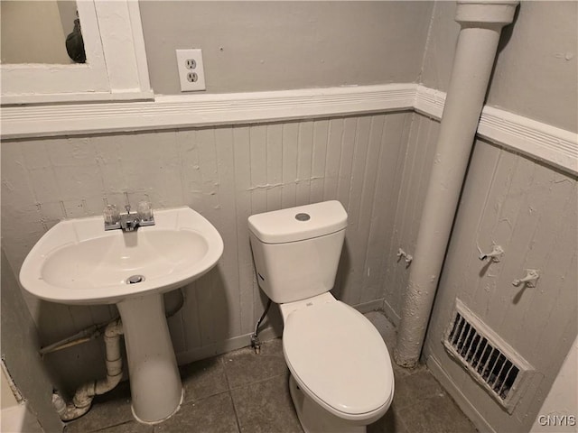 bathroom with tile patterned floors and toilet