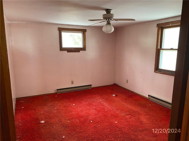 empty room featuring ceiling fan, carpet floors, and a baseboard radiator