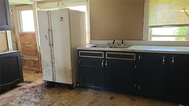 kitchen with white fridge and sink