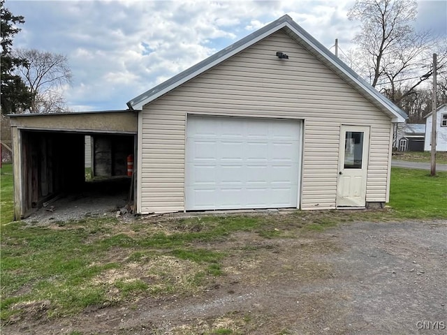 57 Liberty St, Adams, NY 13605 - detached garage featuring driveway