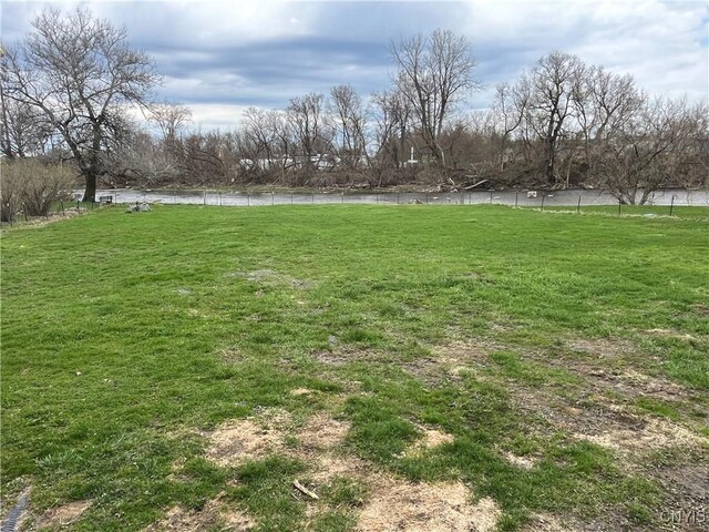 57 Liberty St, Adams, NY 13605 - view of yard with a water view and fence