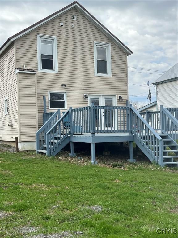 57 Liberty St, Adams, NY 13605 - rear view of property with stairway, a wooden deck, and a lawn
