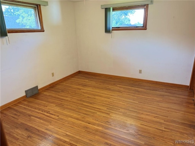 spare room with light wood-type flooring