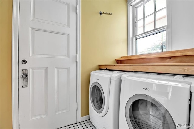 laundry area with separate washer and dryer