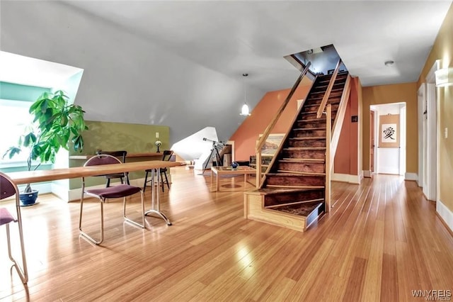 interior space with lofted ceiling and hardwood / wood-style flooring