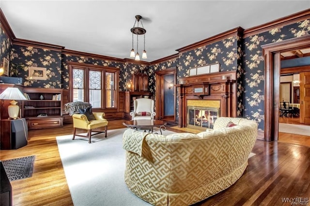 living room featuring hardwood / wood-style floors and ornamental molding