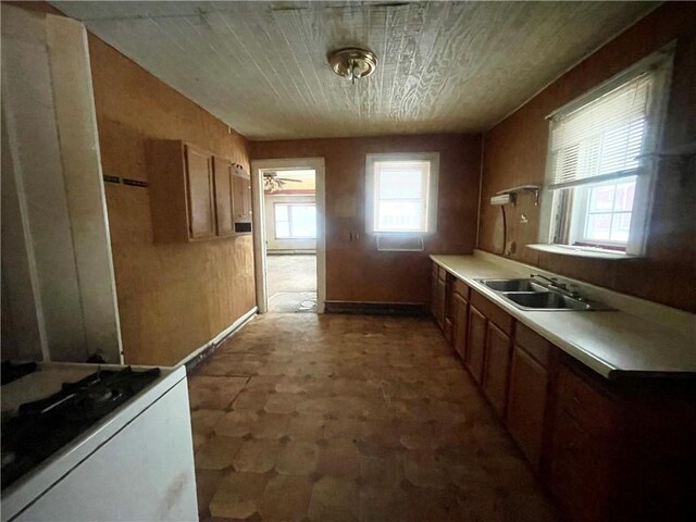 kitchen with sink and white range with gas cooktop