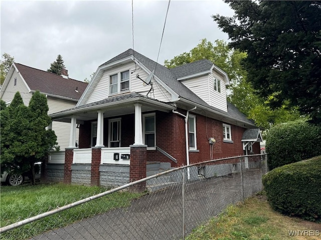 view of property exterior with covered porch