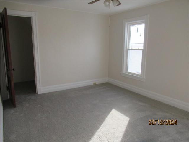 carpeted empty room with ceiling fan