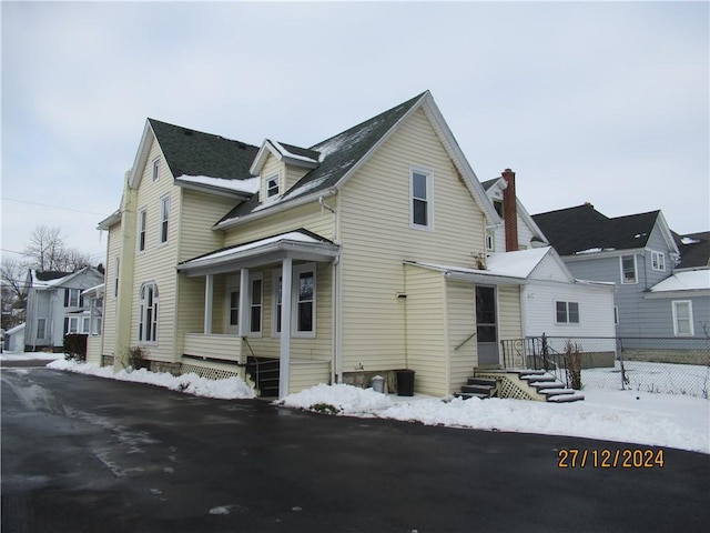 view of snow covered property